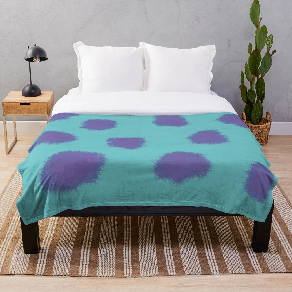 Sully the Monster from Pixar's Monsters Inc. featured on a cozy plush blanket