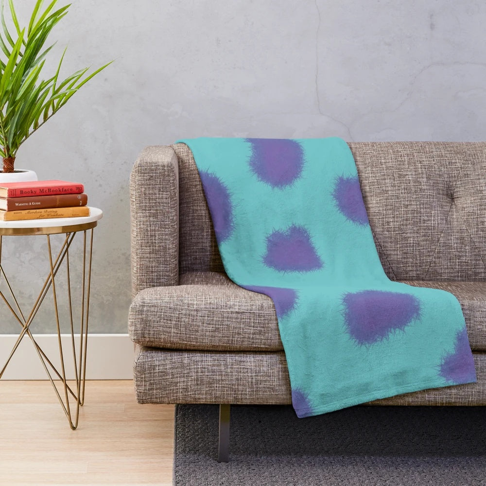 Sully the Monster from Pixar's Monsters Inc. featured on a cozy plush blanket