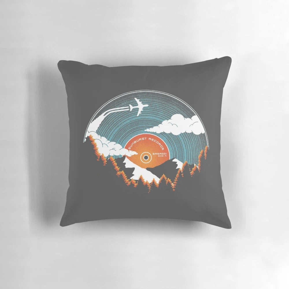 Sunburst Records Redux Pillow featuring a nature-inspired landscape design with trees, mountains, and sky
