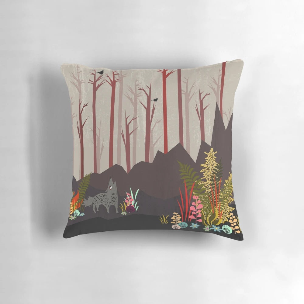Sundance decorative pillow featuring an autumn nature landscape with a wolf, flowers, and trees in orange, brown, and green colors.