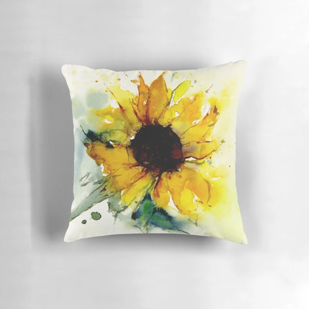 A vibrant sunflower throw pillow featuring a watercolor-style design of yellow flowers and green leaves.
