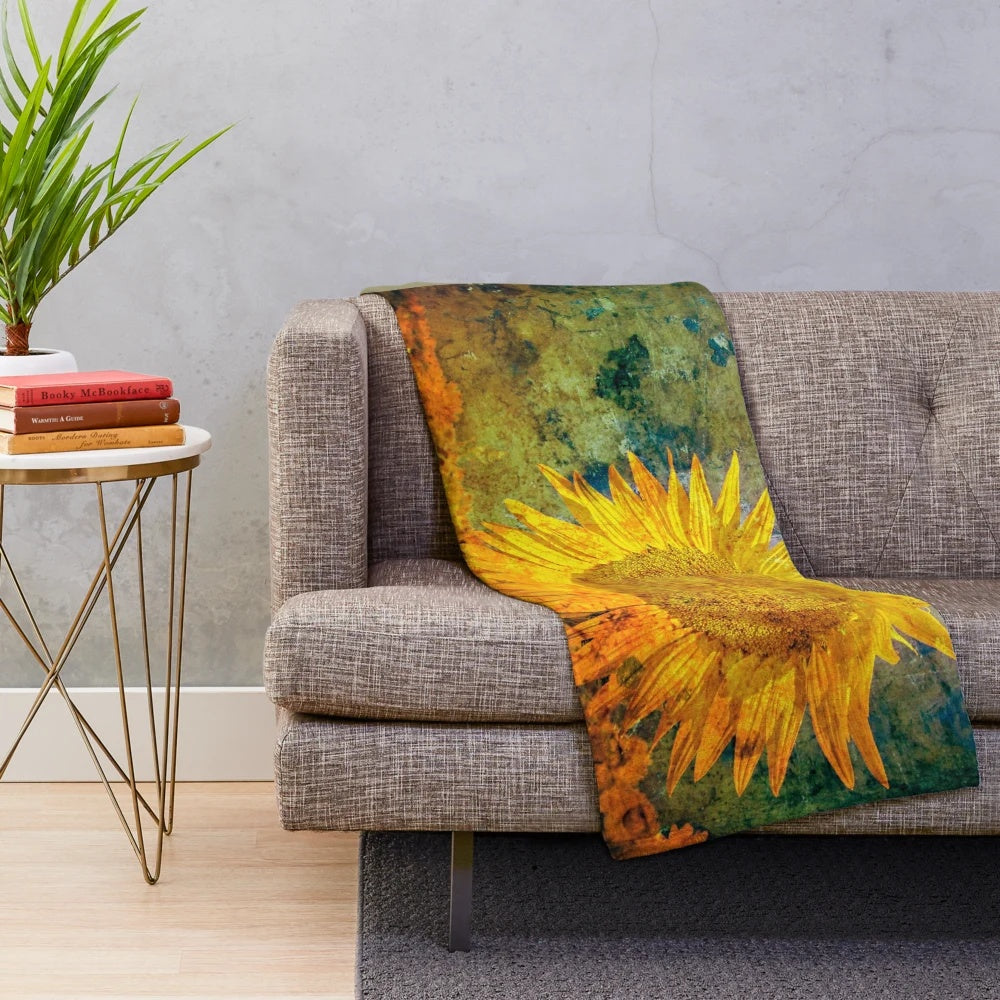 Distressed sunflower plush blanket with textured grunge floral pattern