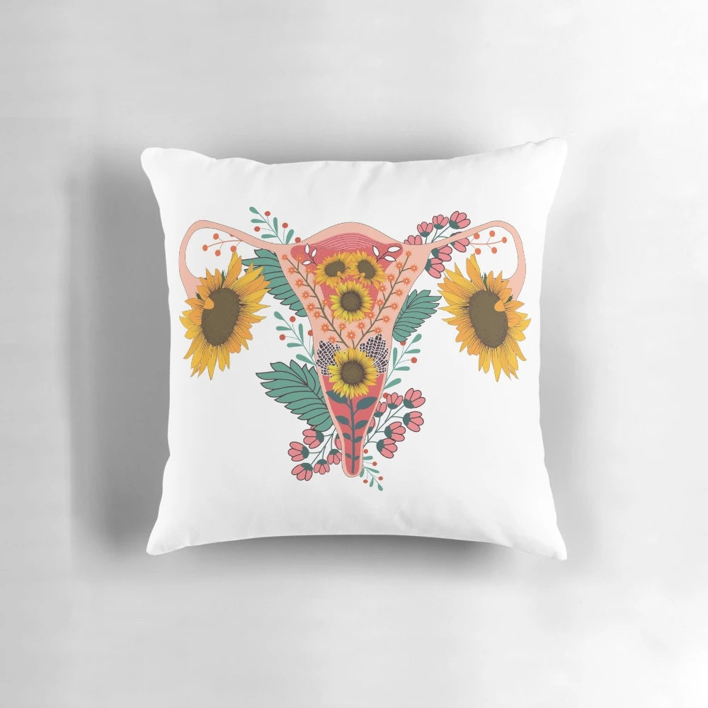 Colorful sunflower-shaped pillow with a uterus design, representing women's health and menstrual pride.