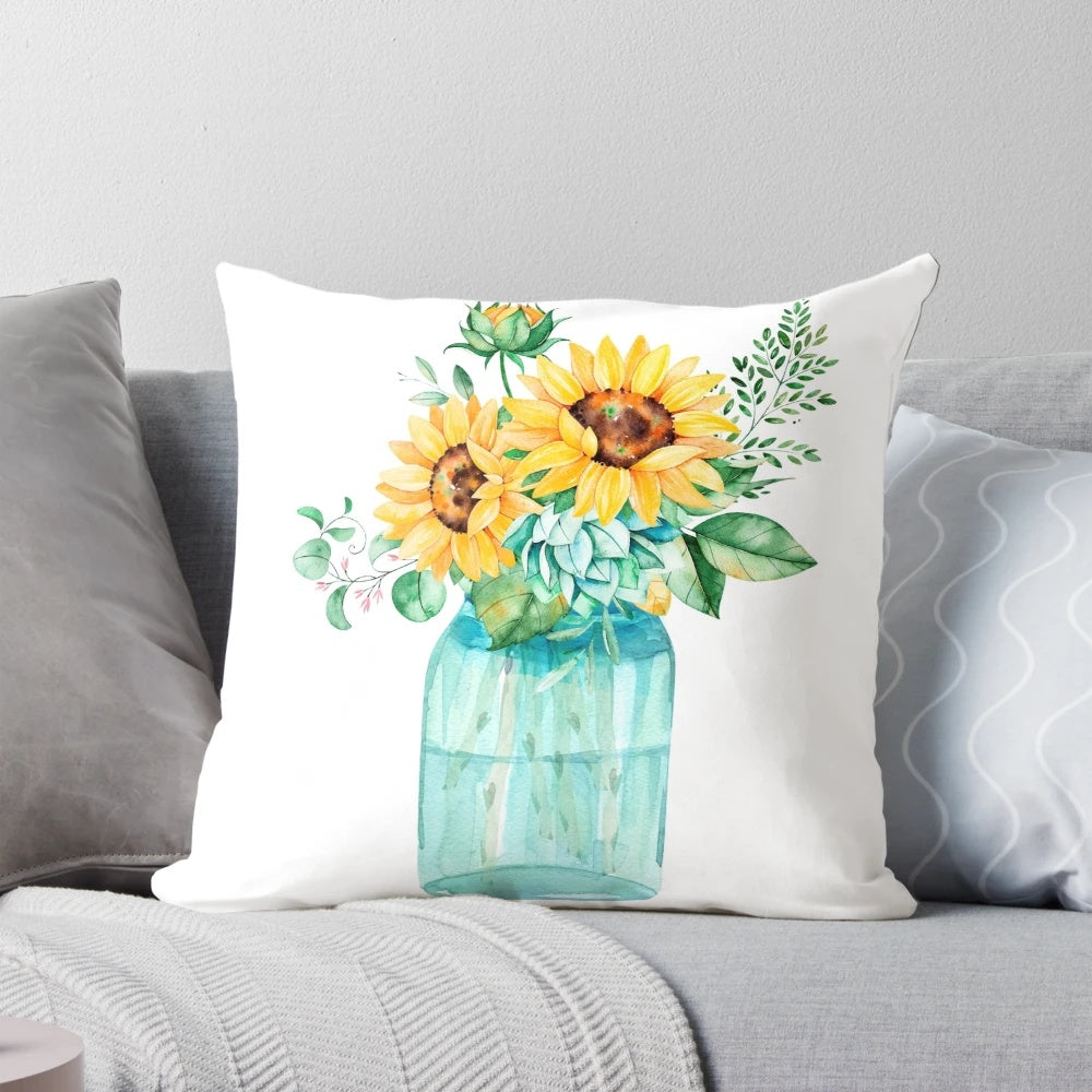 A decorative throw pillow featuring a watercolor painting of sunflowers in a mason jar.