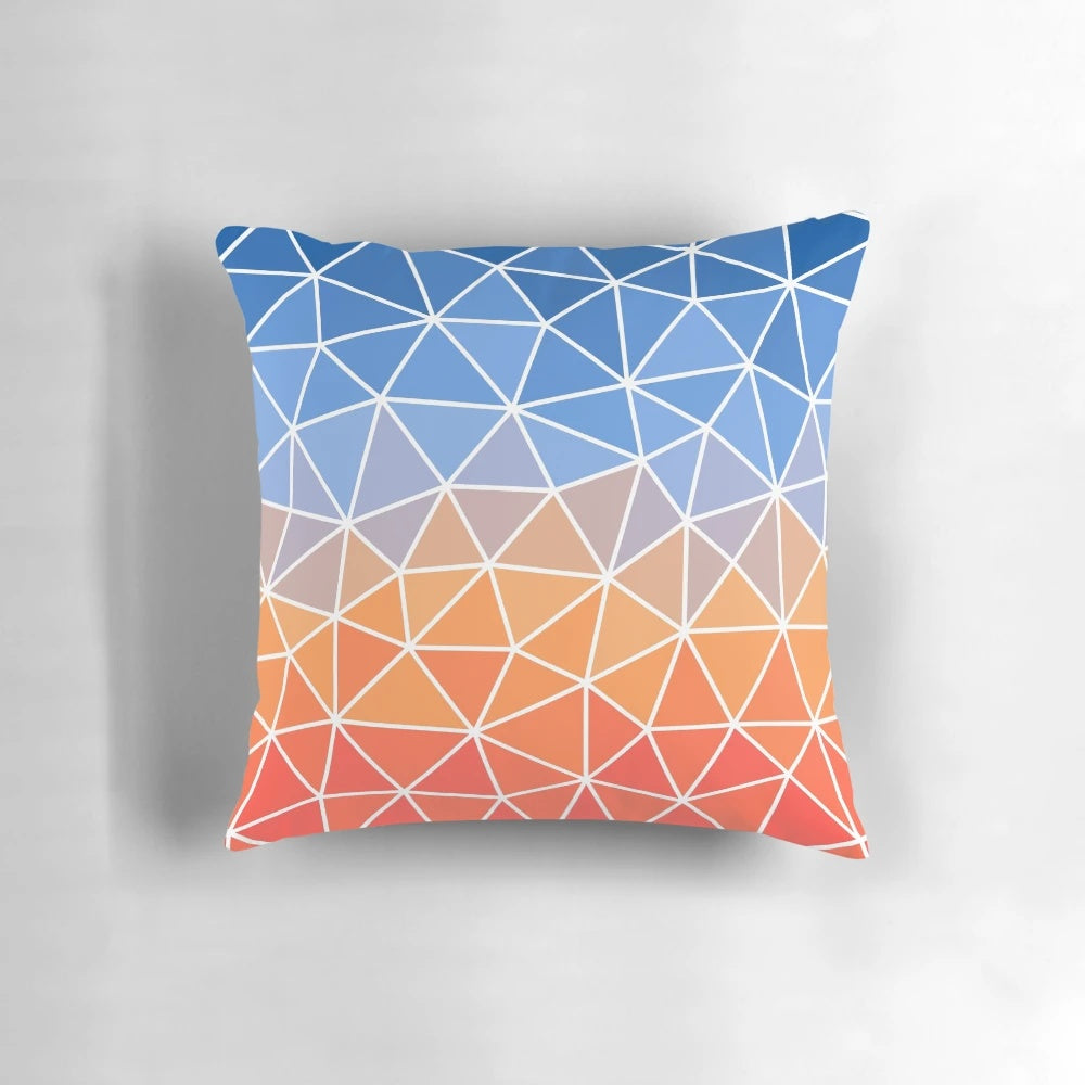 Vibrant geometric pillow with sunrise-inspired colors and patterns, perfect for home decor and supporting hospice care.