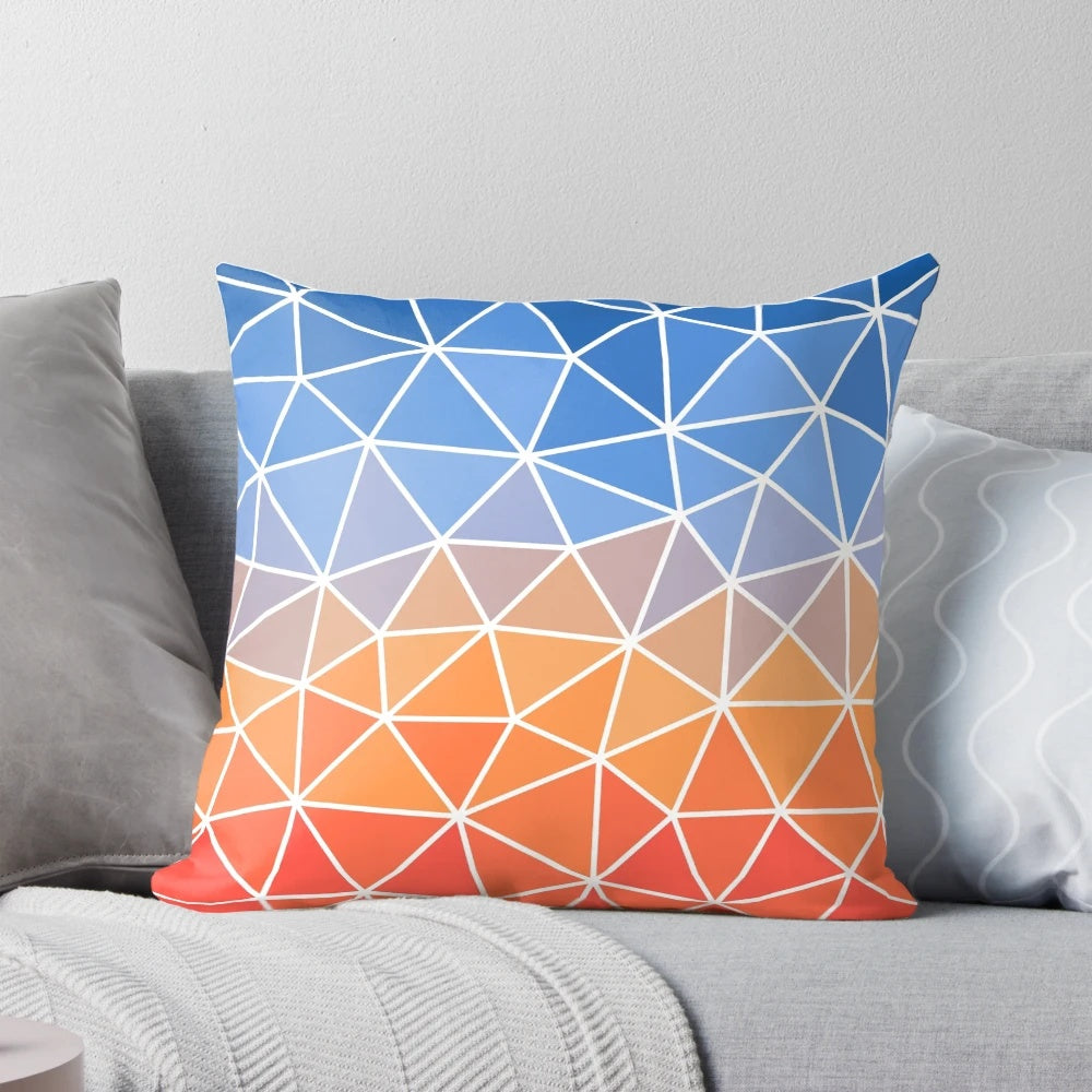 Vibrant geometric pillow with sunrise-inspired colors and patterns, perfect for home decor and supporting hospice care.