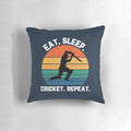 White text pillow with "Eat Sleep Cricket Repeat" design and sunset background