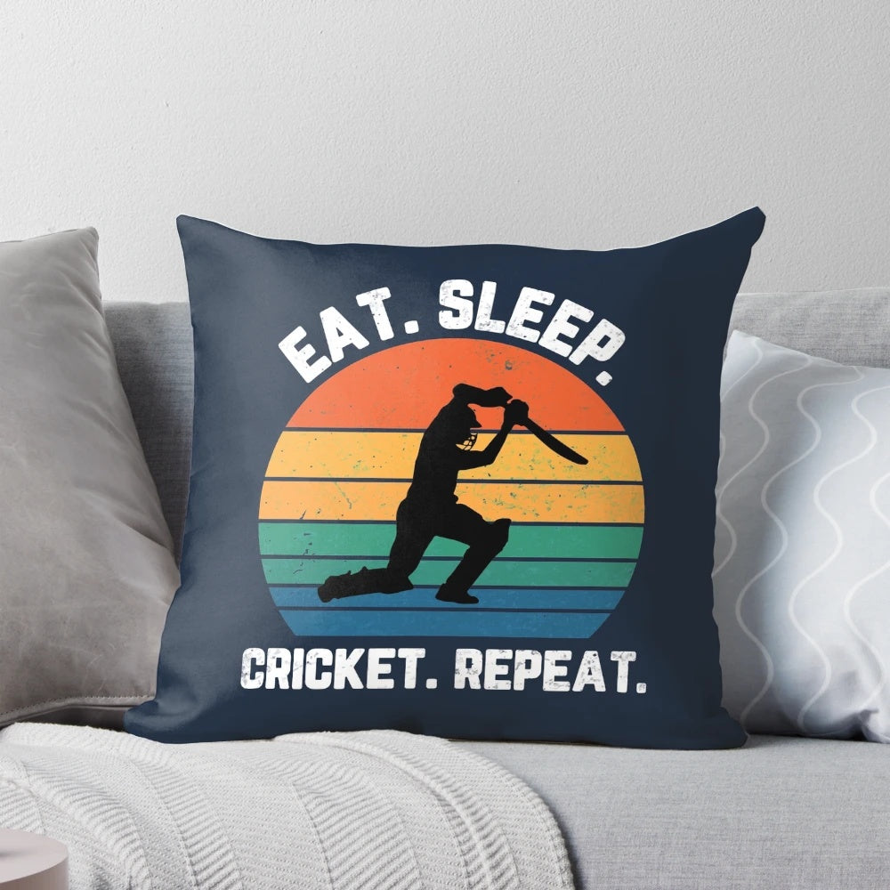 White text pillow with "Eat Sleep Cricket Repeat" design and sunset background