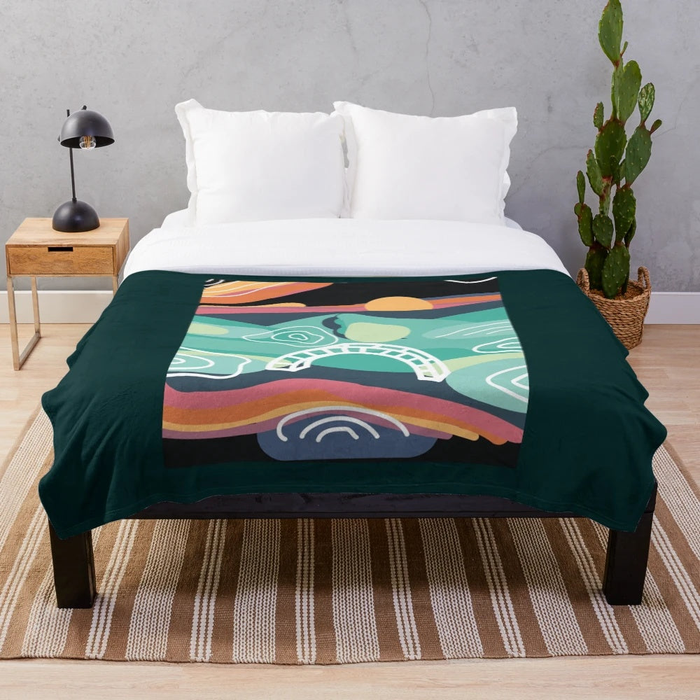 Bonnaroo-inspired plush blanket with sunset artwork