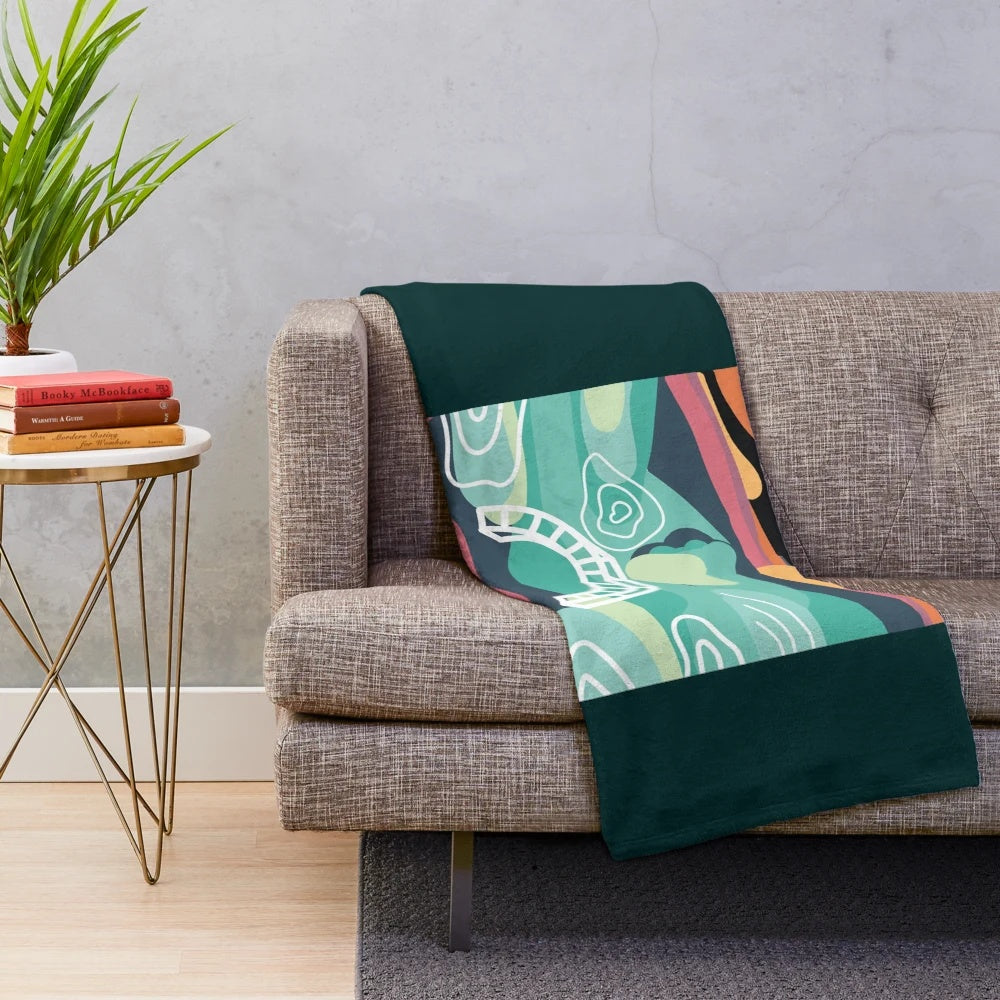 Bonnaroo-inspired plush blanket with sunset artwork