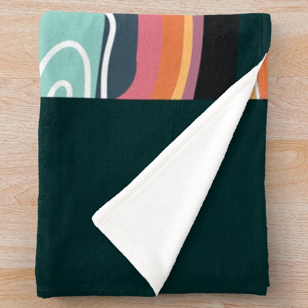 Bonnaroo-inspired plush blanket with sunset artwork
