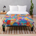 Soft and plush blanket with abstract sunset ocean wave patterns