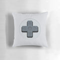 A soft, plush pillow in the shape of a classic video game controller d-pad.