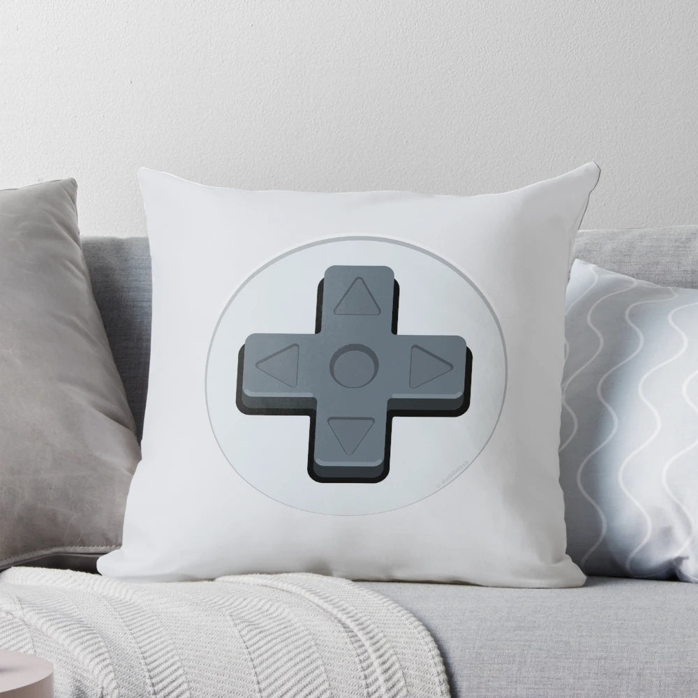 A soft, plush pillow in the shape of a classic video game controller d-pad.