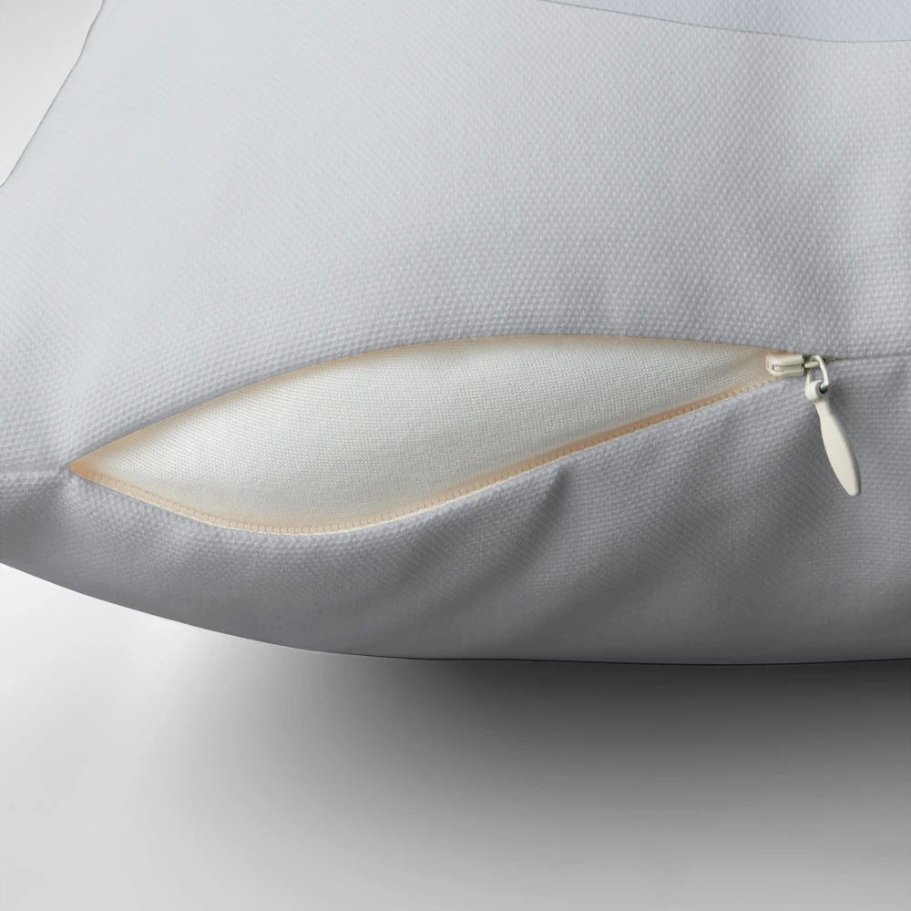 A soft, plush pillow in the shape of a classic video game controller d-pad.