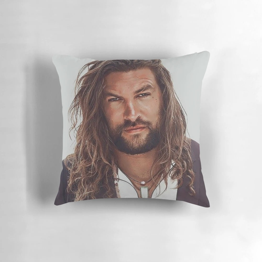 Soft, plush pillow featuring a portrait of actor Jason Momoa, known for his roles in superhero films.