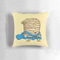 A plush, decorative pillow shaped like a superhero-themed pancake, featuring a cape and superhero design.