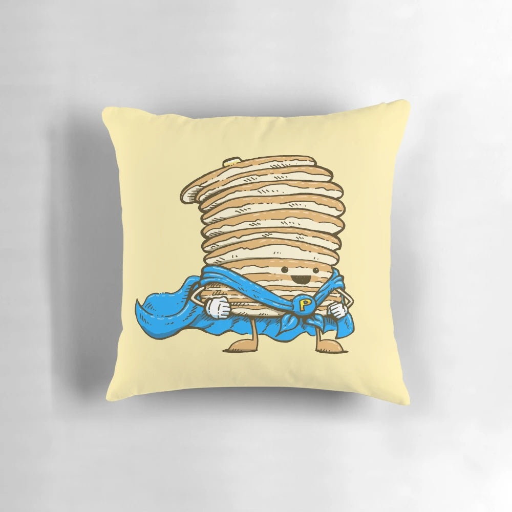 A plush, decorative pillow shaped like a superhero-themed pancake, featuring a cape and superhero design.