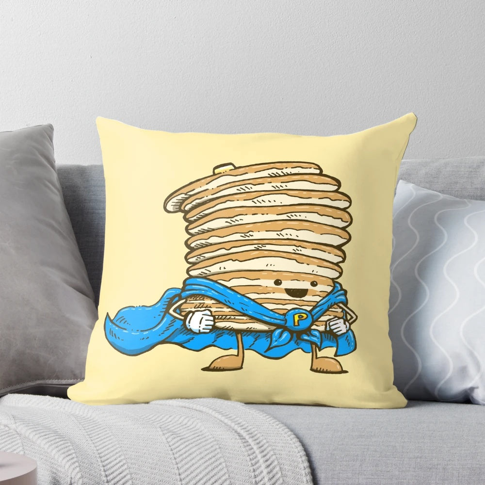 A plush, decorative pillow shaped like a superhero-themed pancake, featuring a cape and superhero design.
