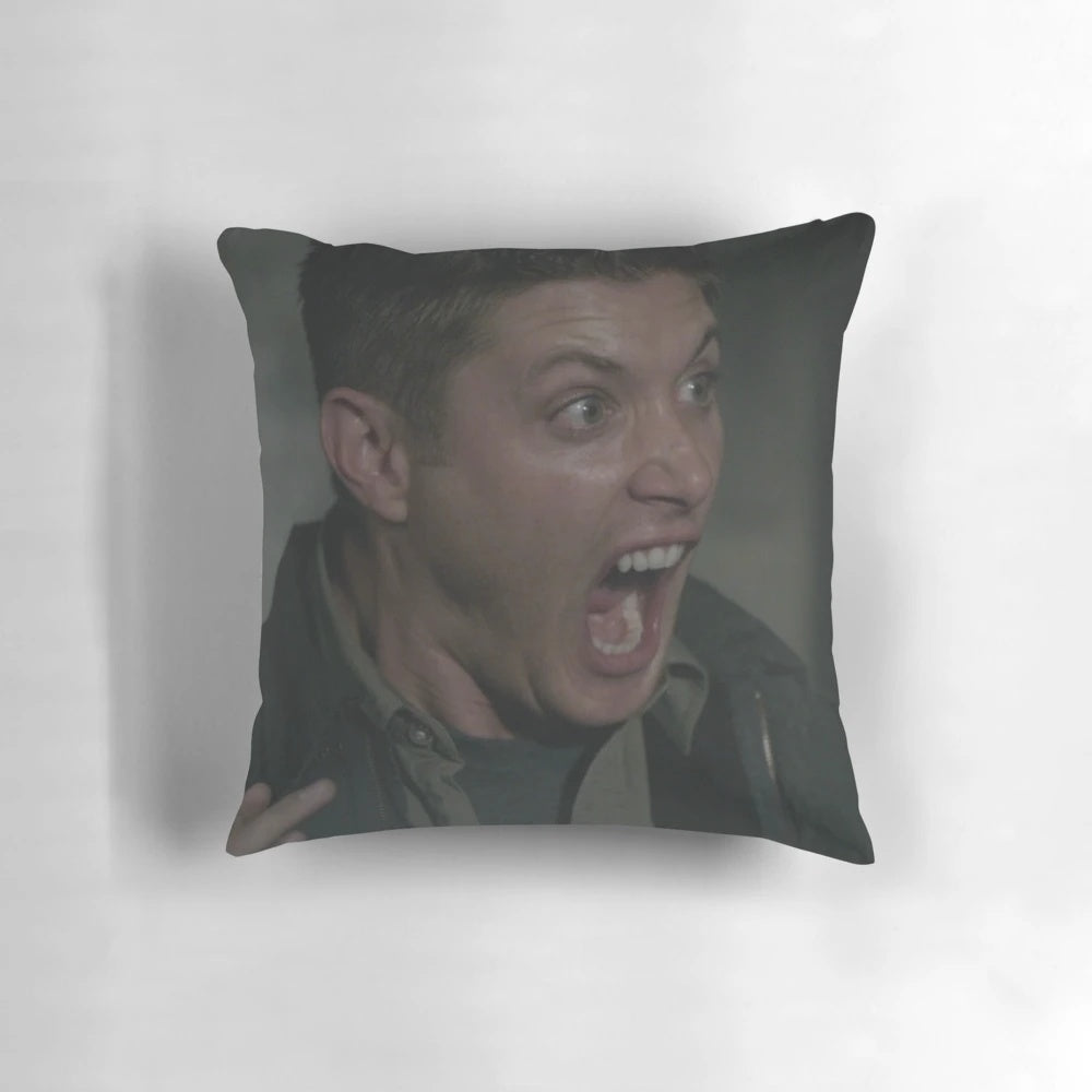 A plush pillow featuring a screaming image of Dean Winchester, the character from the popular TV series Supernatural.