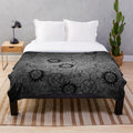 Grey plush blanket with supernatural-inspired design