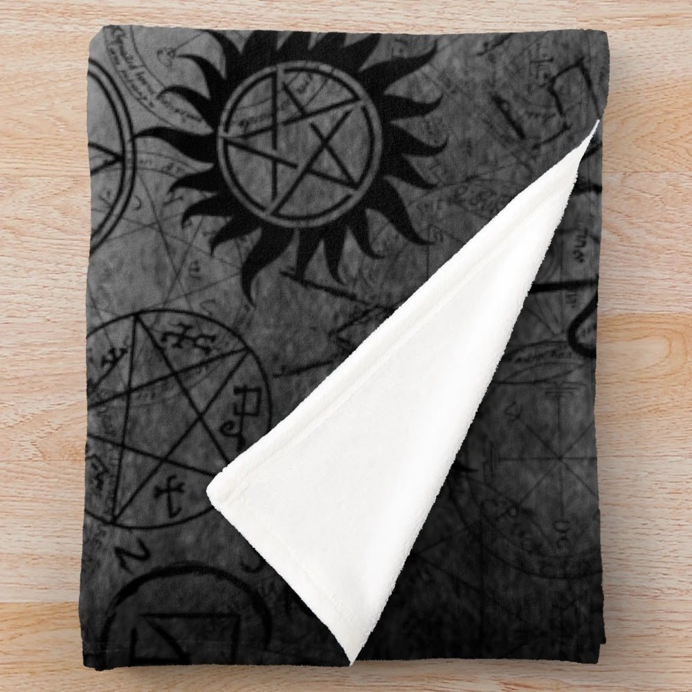 Grey plush blanket with supernatural-inspired design