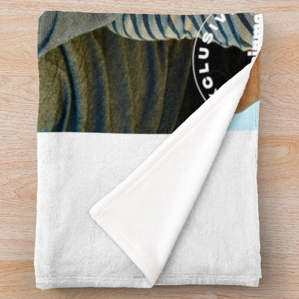 Supernatural-themed plush blanket with illustrations of the Winchester brothers and Castiel