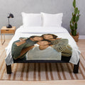 Supernatural-inspired plush blanket with images of Jared Padalecki, Jensen Ackles, and Misha Collins