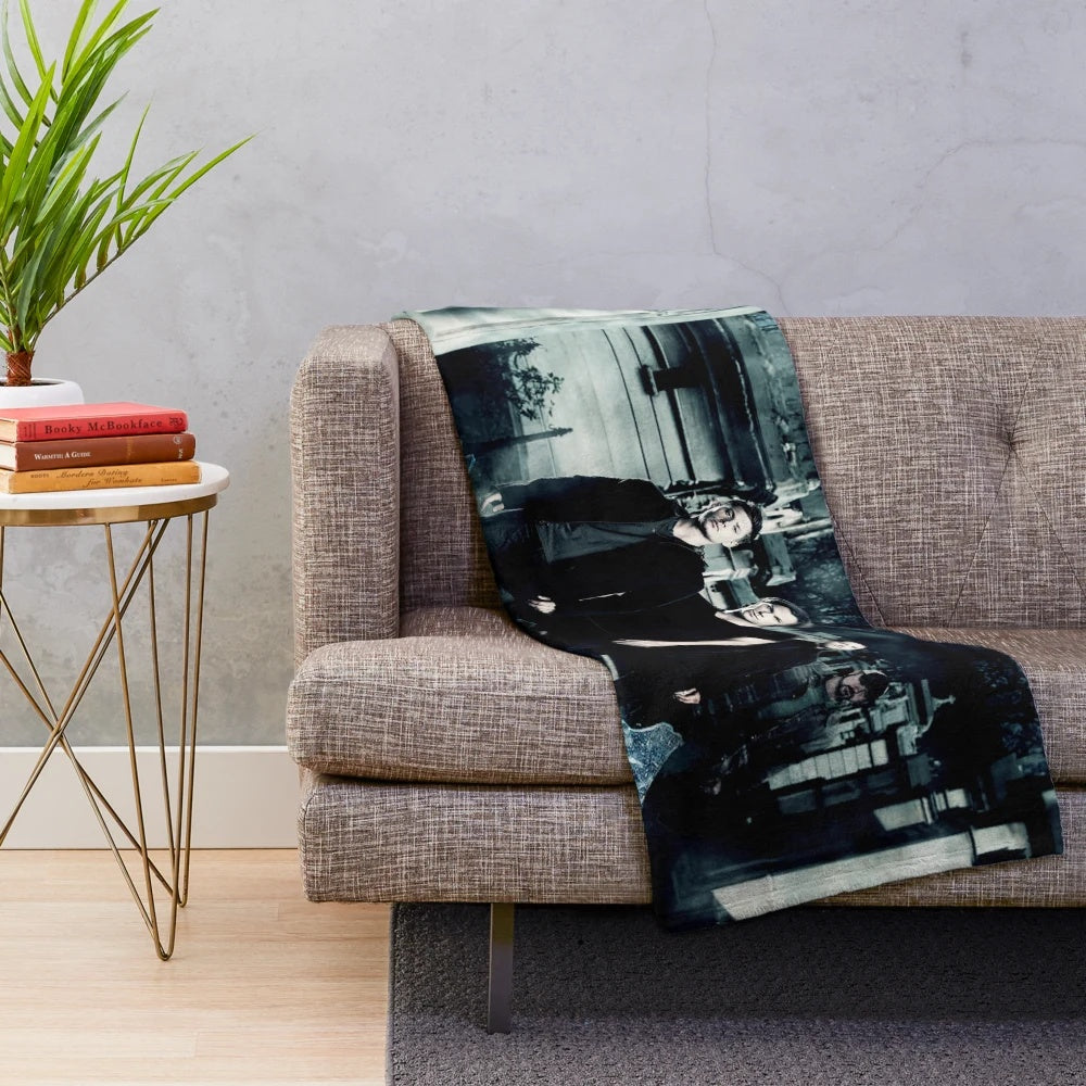 Supernatural-inspired plush blanket with Winchester brothers and other iconic characters