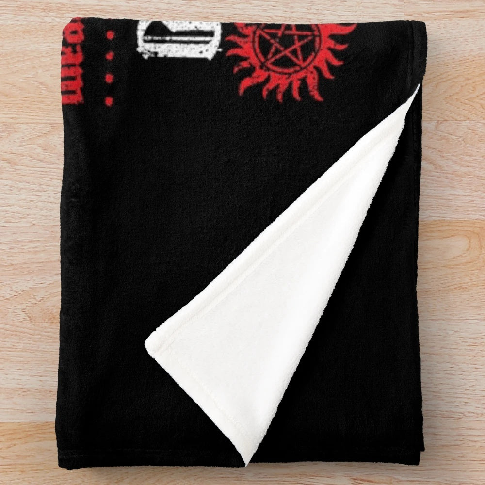 Supernatural-themed plush blanket with characters and symbols