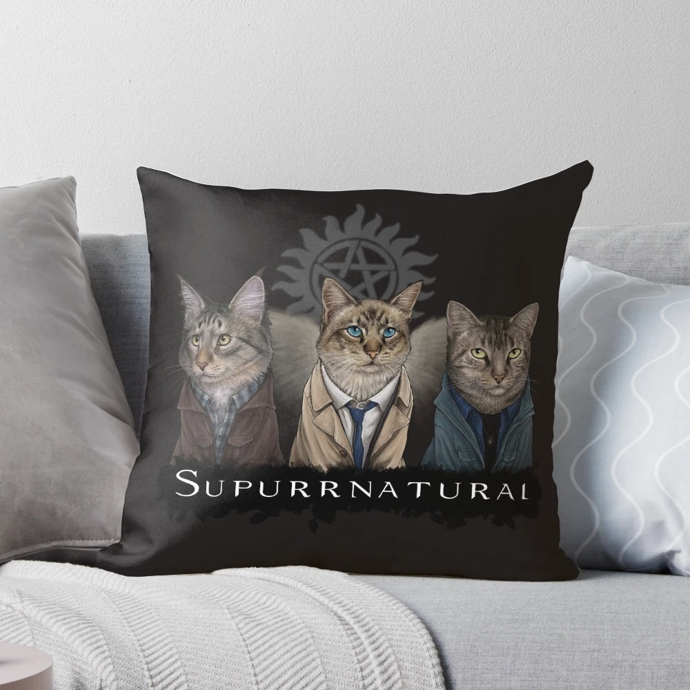 Supernatural-themed pillow featuring Sam, Dean, and Castiel with cats
