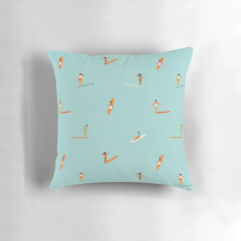 A plush, ocean-themed pillow featuring a stylized surf goddess design