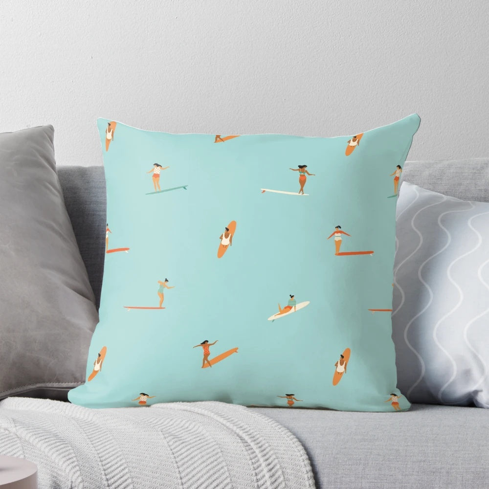 A plush, ocean-themed pillow featuring a stylized surf goddess design