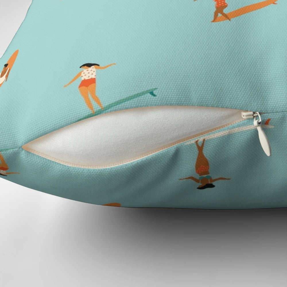 A plush, ocean-themed pillow featuring a stylized surf goddess design