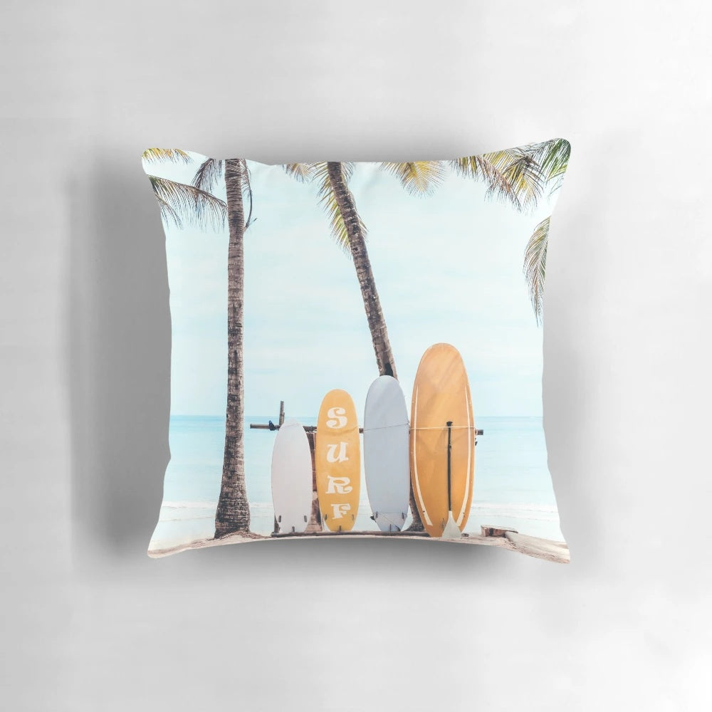 Surfboard-shaped pillow with wave and beach-inspired design