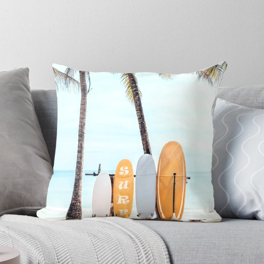 Surfboard-shaped pillow with wave and beach-inspired design