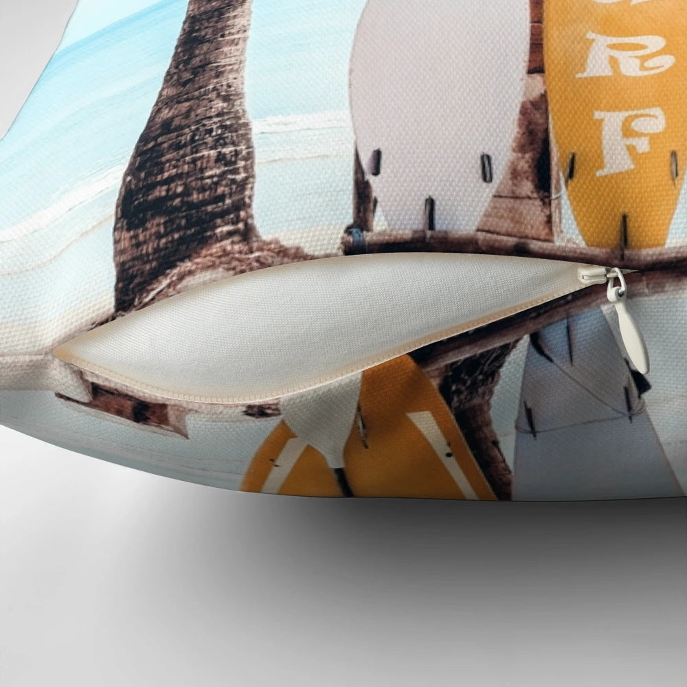 Surfboard-shaped pillow with wave and beach-inspired design