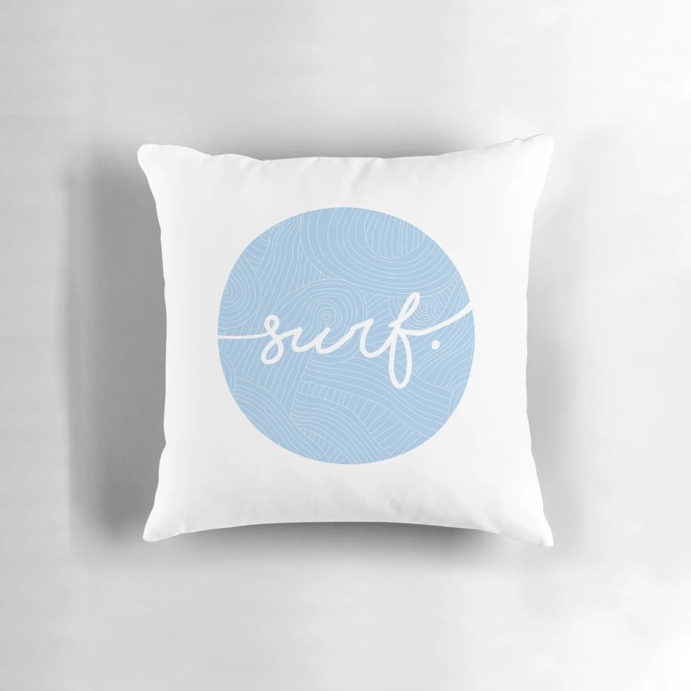 A soft, round pillow with a swirling blue and white pattern, inspired by the waves and surf lifestyle.