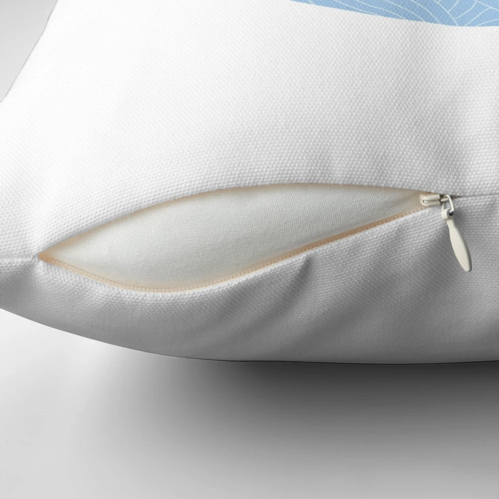 A soft, round pillow with a swirling blue and white pattern, inspired by the waves and surf lifestyle.