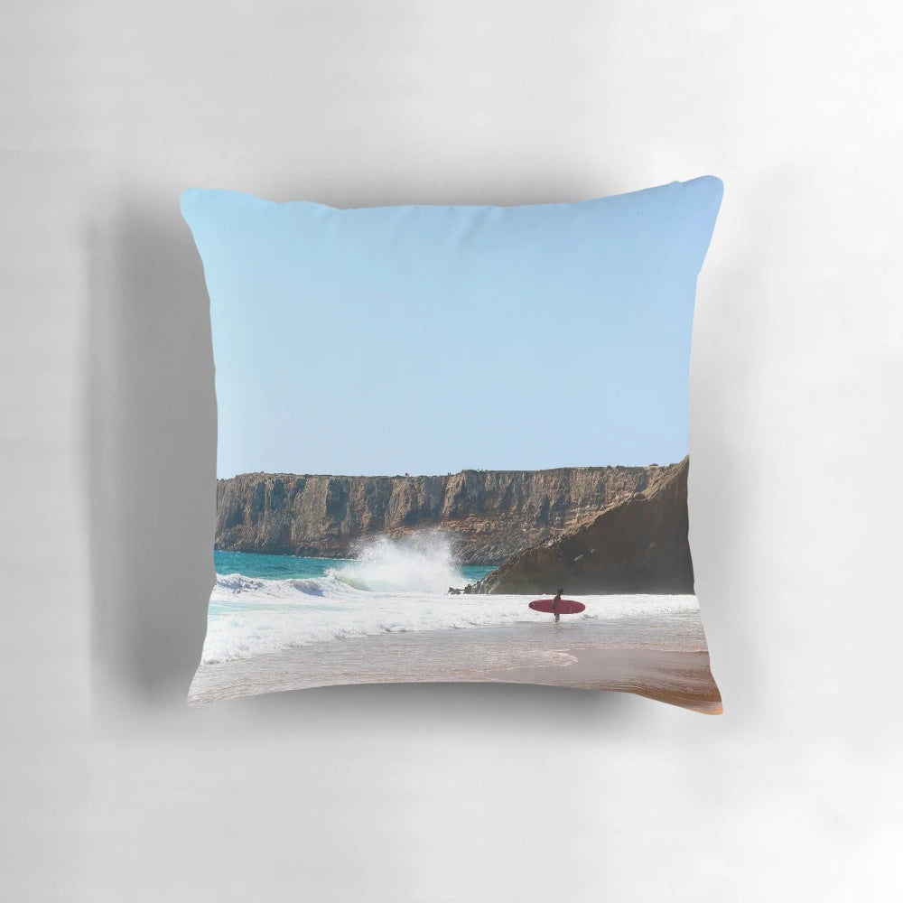 Vibrant surfing-themed pillow featuring waves, ocean, and Portugal landscape