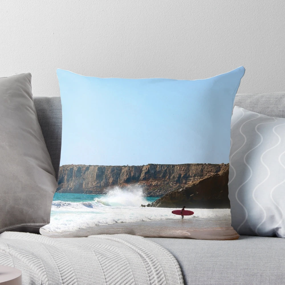 Vibrant surfing-themed pillow featuring waves, ocean, and Portugal landscape
