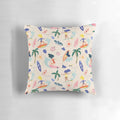 Colorful and vibrant 'Surfing Girl' pillow with a surfer riding a wave on a beach background