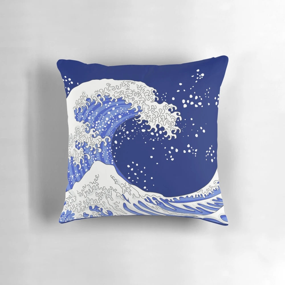 A beautiful pillow featuring the iconic "Great Wave off Kanagawa" design in shades of blue and navy.