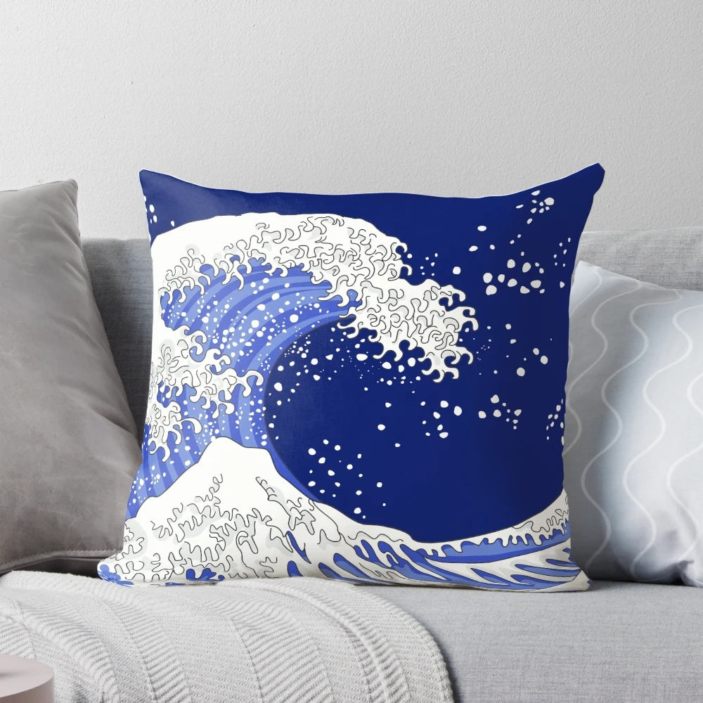 A beautiful pillow featuring the iconic "Great Wave off Kanagawa" design in shades of blue and navy.