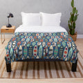 Blue plush blanket with surfboard-inspired graphic design
