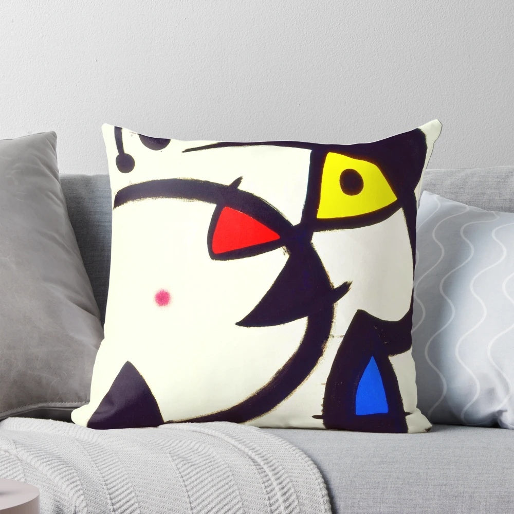Abstract surreal art pillow featuring the style and imagery of Spanish artist Joan Miró