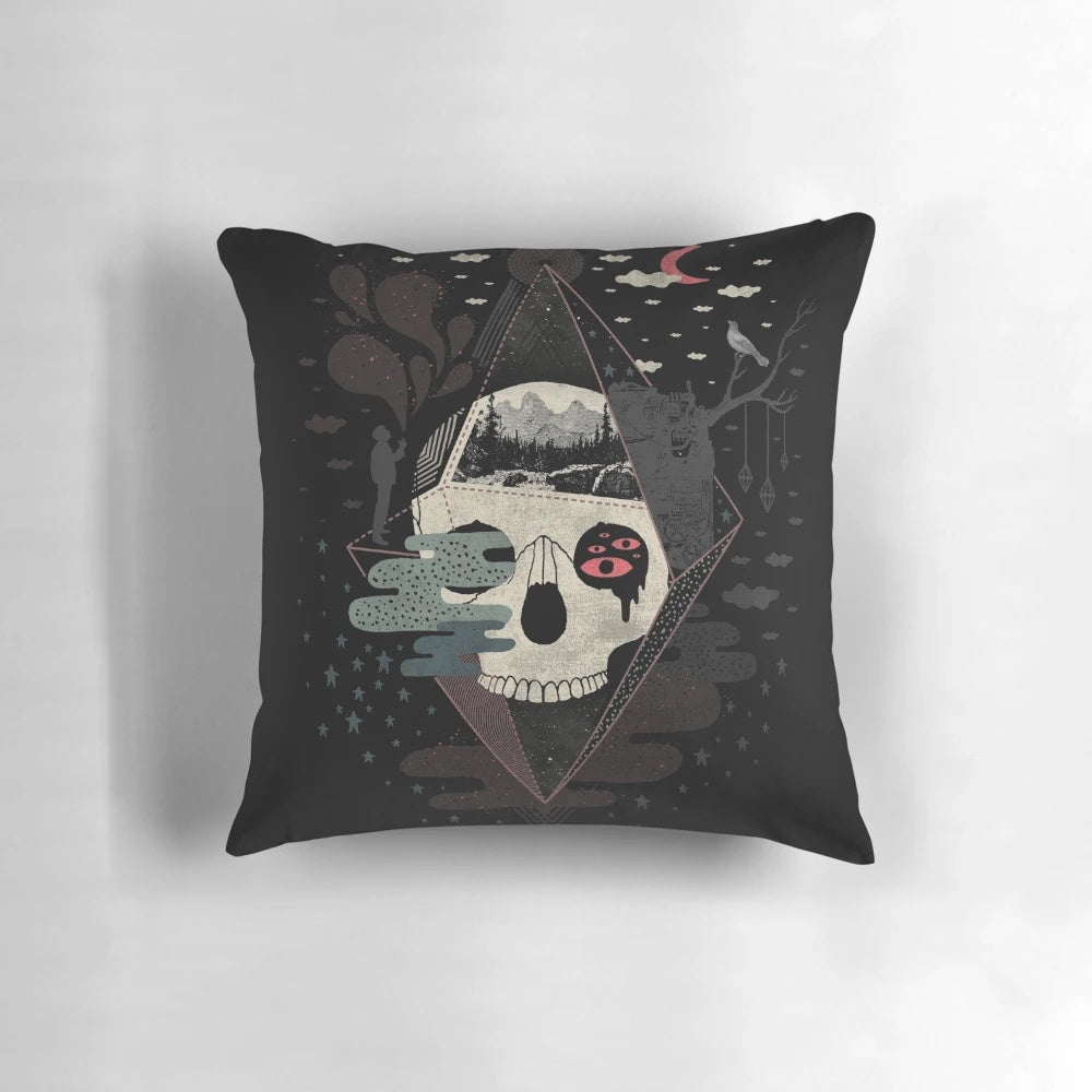 Surreal abstract pillow featuring a diamond-patterned skull against a night sky with trees and a moon