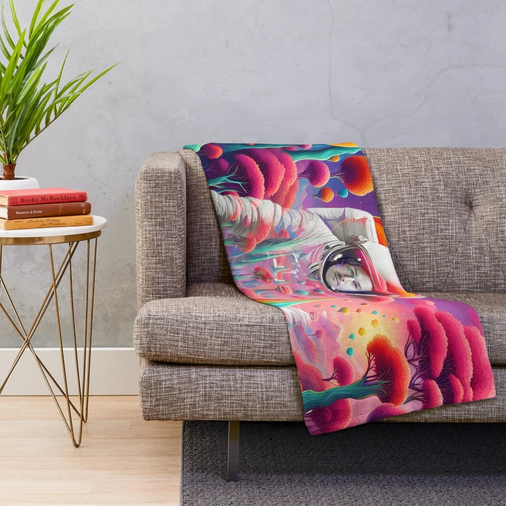 Surreal astronaut plush blanket featuring intergalactic and alien world design