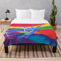 Colorful surreal plush blanket featuring a fantasy alien creature in flight