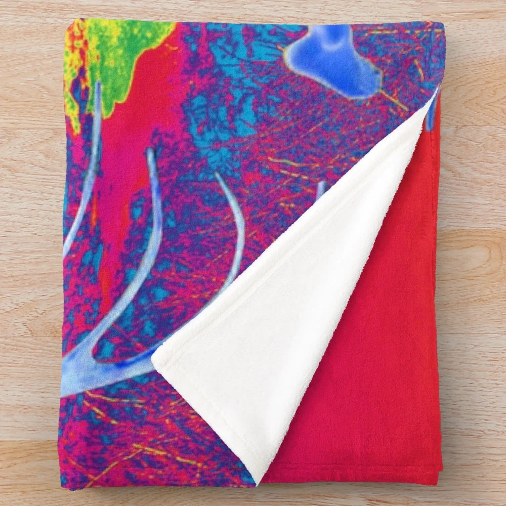 Colorful surreal plush blanket featuring a fantasy alien creature in flight